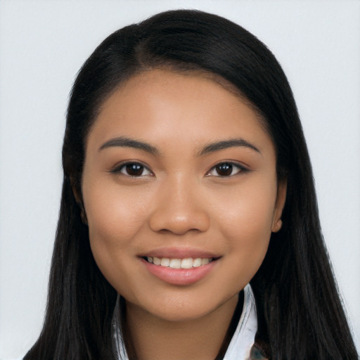 Joyful latino young-adult female with long  black hair and brown eyes