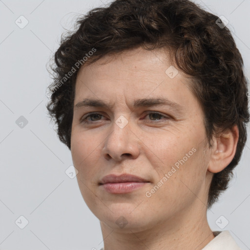 Joyful white adult female with short  brown hair and brown eyes