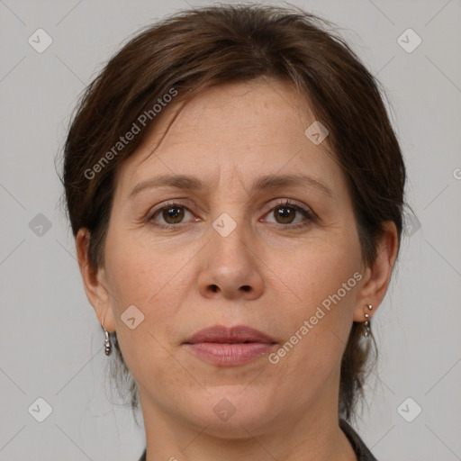 Joyful white adult female with medium  brown hair and brown eyes