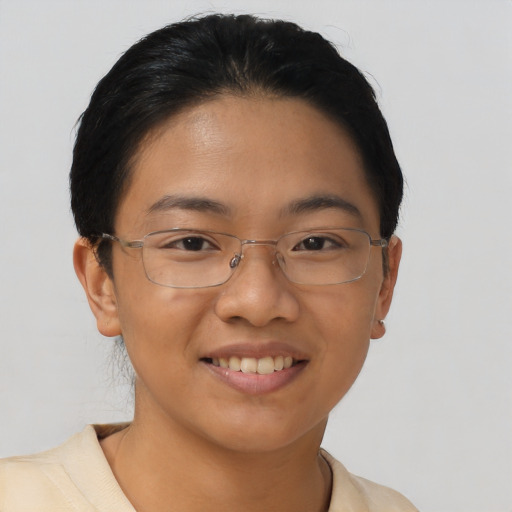 Joyful asian young-adult female with short  brown hair and brown eyes
