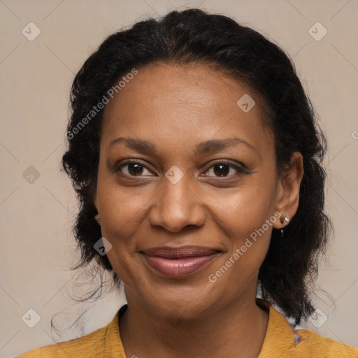 Joyful black adult female with medium  brown hair and brown eyes