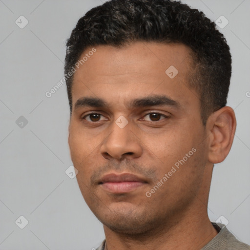 Neutral latino young-adult male with short  black hair and brown eyes