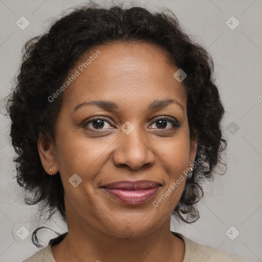 Joyful black adult female with medium  brown hair and brown eyes