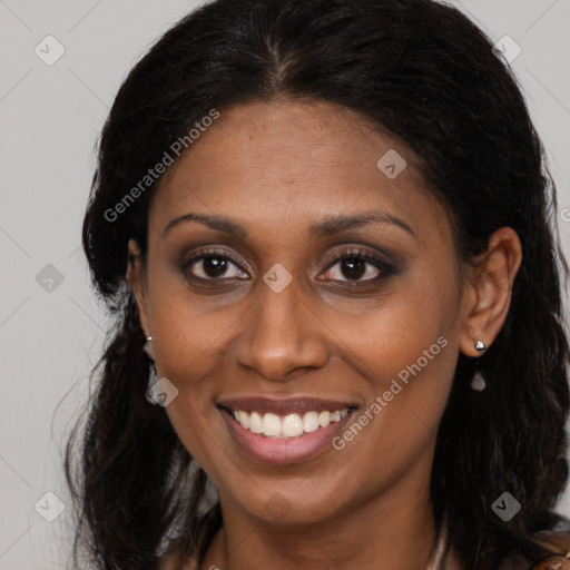 Joyful latino young-adult female with long  brown hair and brown eyes