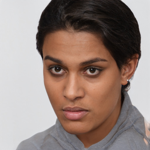 Neutral latino young-adult female with short  brown hair and brown eyes