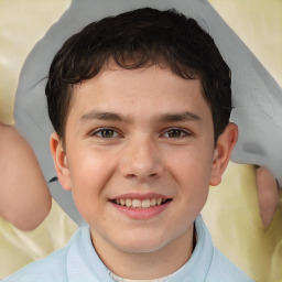 Joyful white child male with short  brown hair and brown eyes