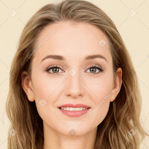 Joyful white young-adult female with long  brown hair and blue eyes