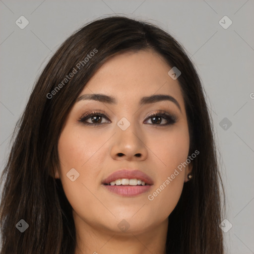 Joyful asian young-adult female with long  brown hair and brown eyes