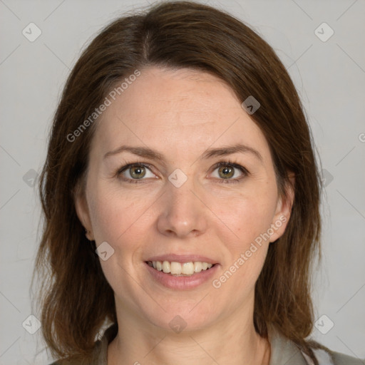 Joyful white young-adult female with medium  brown hair and green eyes