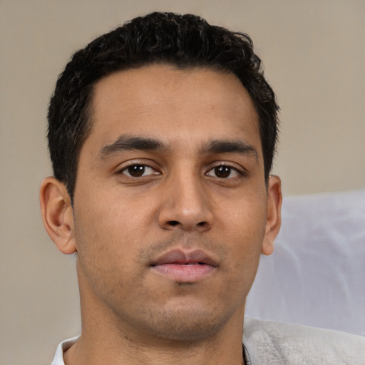 Neutral latino young-adult male with short  brown hair and brown eyes