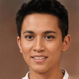 Joyful latino young-adult male with short  brown hair and brown eyes