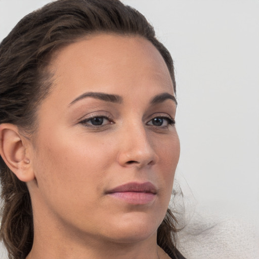 Neutral white young-adult female with long  brown hair and brown eyes