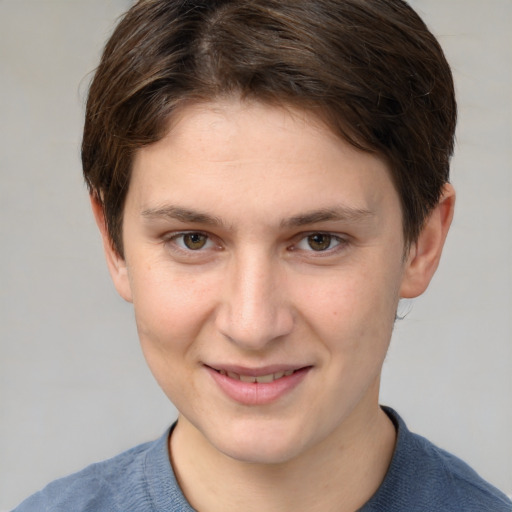 Joyful white young-adult female with short  brown hair and grey eyes