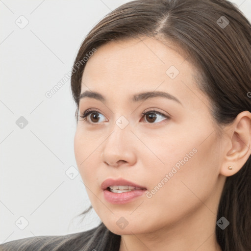 Neutral white young-adult female with long  brown hair and brown eyes