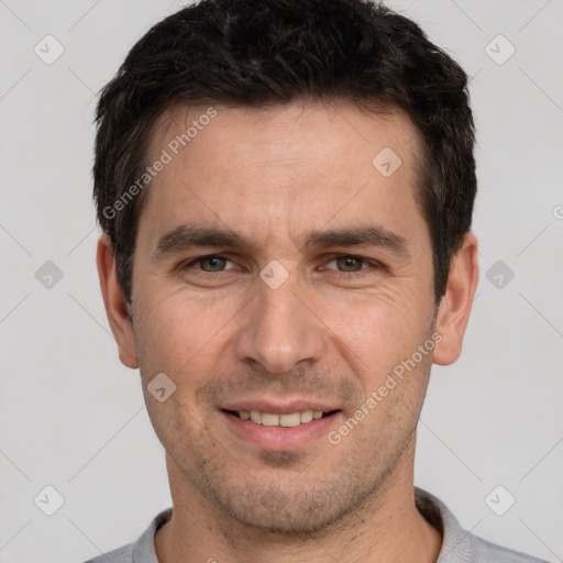 Joyful white young-adult male with short  brown hair and brown eyes