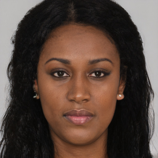 Neutral black young-adult female with long  brown hair and brown eyes