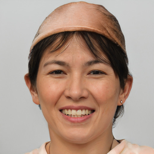 Joyful white adult female with medium  brown hair and brown eyes