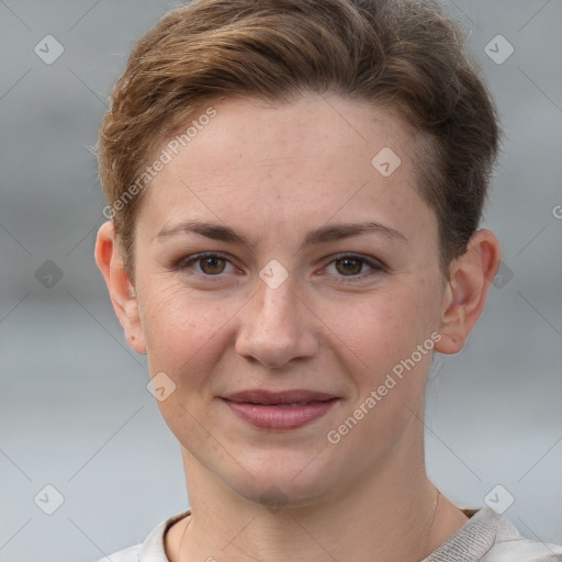 Joyful white young-adult female with short  brown hair and grey eyes