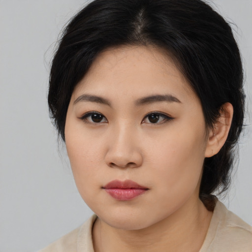 Neutral asian young-adult female with medium  brown hair and brown eyes