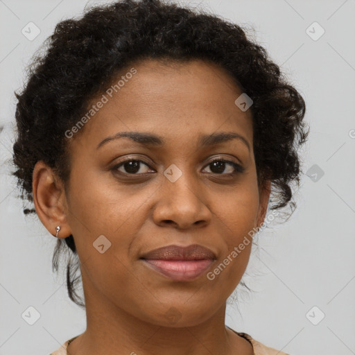 Joyful black adult female with short  brown hair and brown eyes