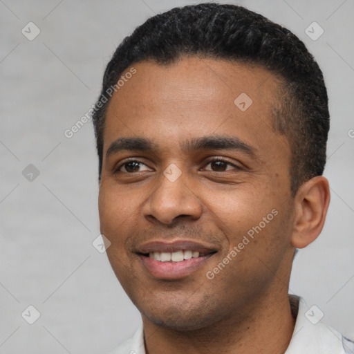 Joyful latino young-adult male with short  black hair and brown eyes