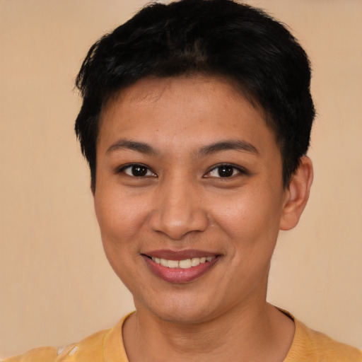 Joyful latino young-adult female with short  brown hair and brown eyes