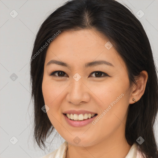 Joyful asian young-adult female with medium  brown hair and brown eyes