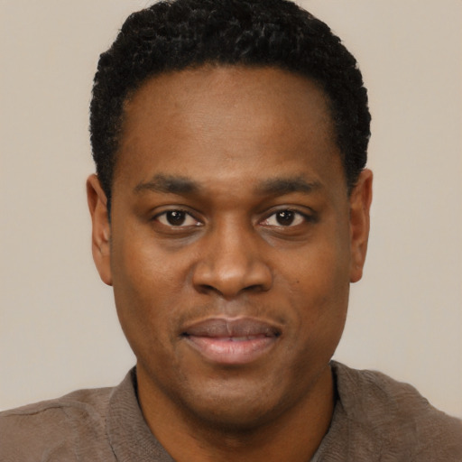 Neutral black young-adult male with short  black hair and brown eyes