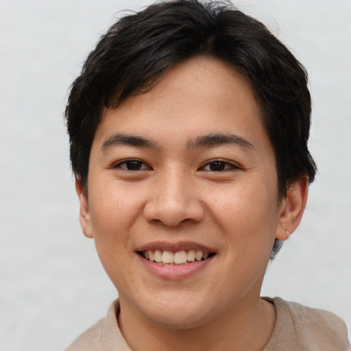 Joyful asian young-adult female with short  brown hair and brown eyes
