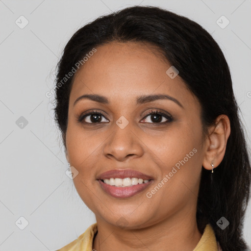 Joyful latino young-adult female with long  brown hair and brown eyes