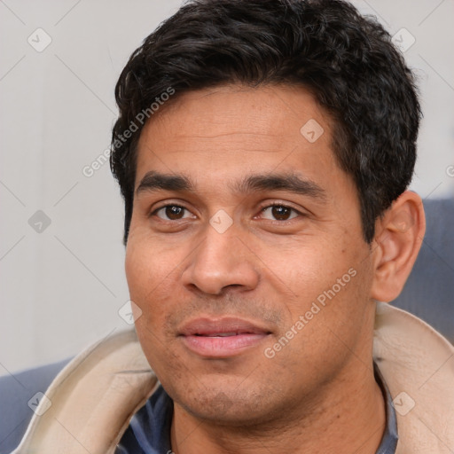 Joyful white young-adult male with short  black hair and brown eyes