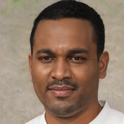 Neutral black adult male with short  black hair and brown eyes