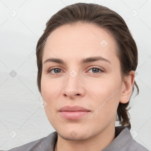 Neutral white young-adult female with short  brown hair and brown eyes