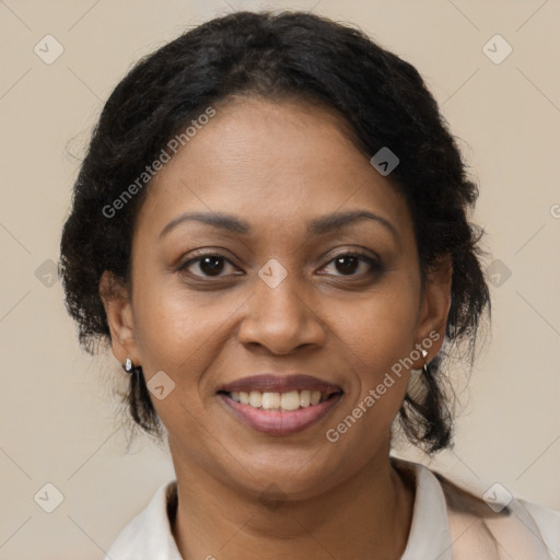 Joyful black adult female with medium  brown hair and brown eyes