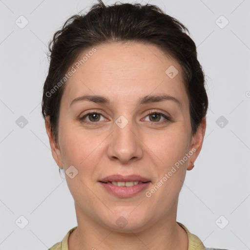 Joyful white adult female with short  brown hair and brown eyes