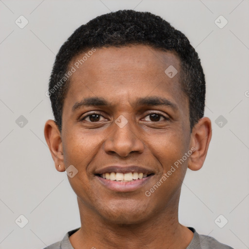 Joyful black young-adult male with short  black hair and brown eyes