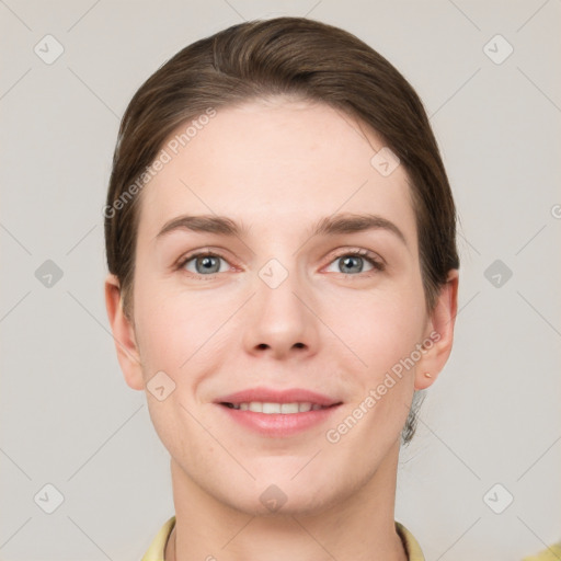 Joyful white young-adult female with short  brown hair and grey eyes