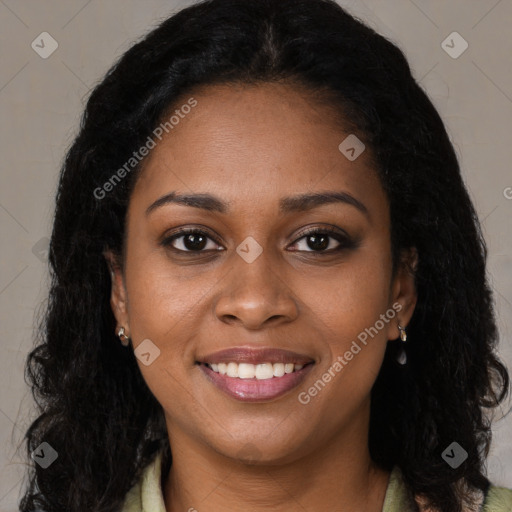 Joyful black young-adult female with long  brown hair and brown eyes