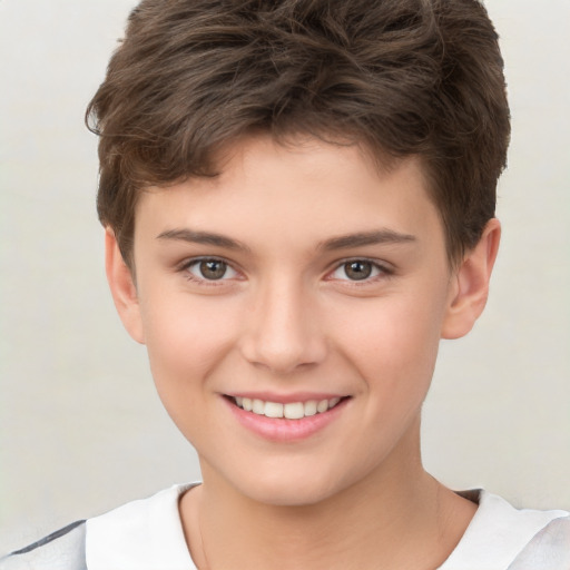 Joyful white child male with short  brown hair and brown eyes