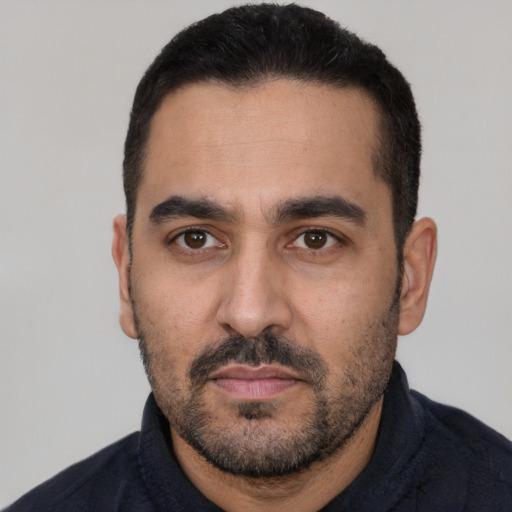 Neutral latino adult male with short  black hair and brown eyes