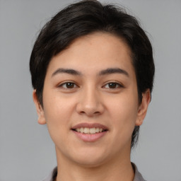 Joyful asian young-adult female with short  brown hair and brown eyes