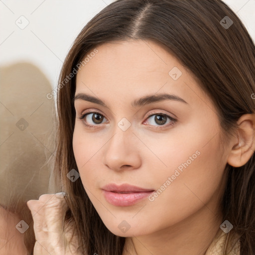 Neutral white young-adult female with long  brown hair and brown eyes