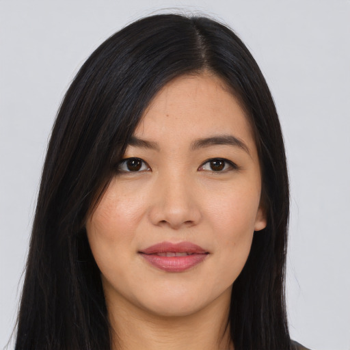 Joyful asian young-adult female with long  black hair and brown eyes