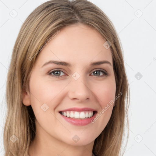 Joyful white young-adult female with long  brown hair and green eyes