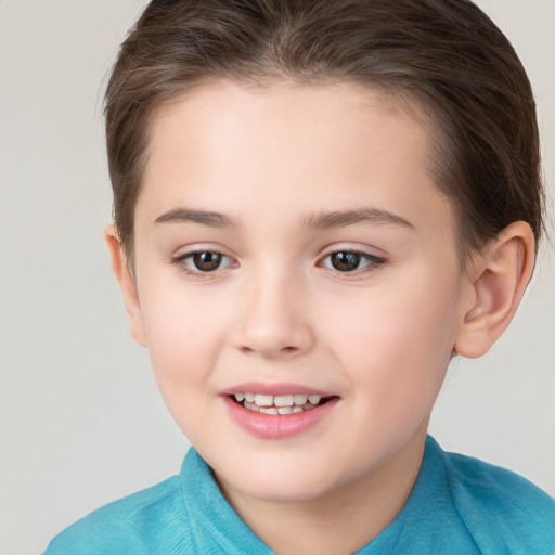 Joyful white child female with short  brown hair and brown eyes