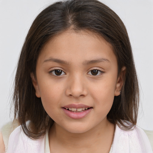 Joyful white child female with medium  brown hair and brown eyes