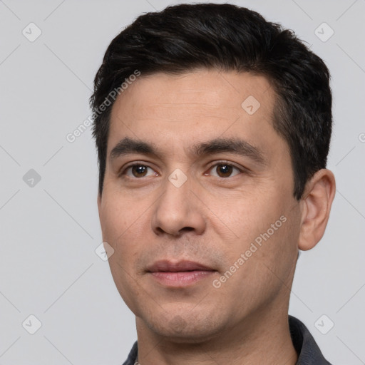 Joyful white young-adult male with short  black hair and brown eyes