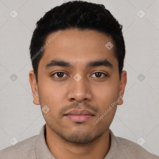 Neutral latino young-adult male with short  black hair and brown eyes