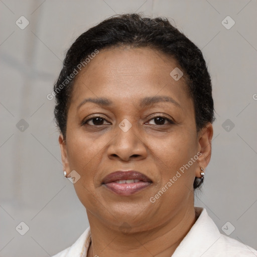 Joyful black adult female with short  brown hair and brown eyes