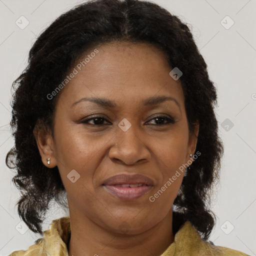 Joyful black adult female with medium  brown hair and brown eyes